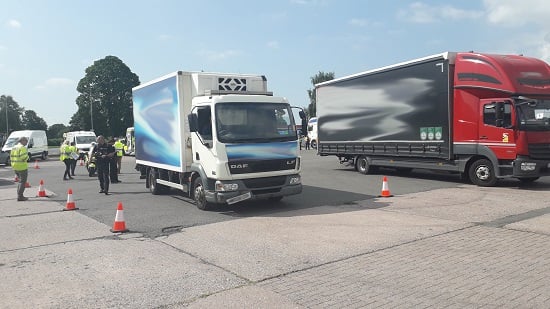 Image of officers engaging with HGV drivers as part of a local campaign