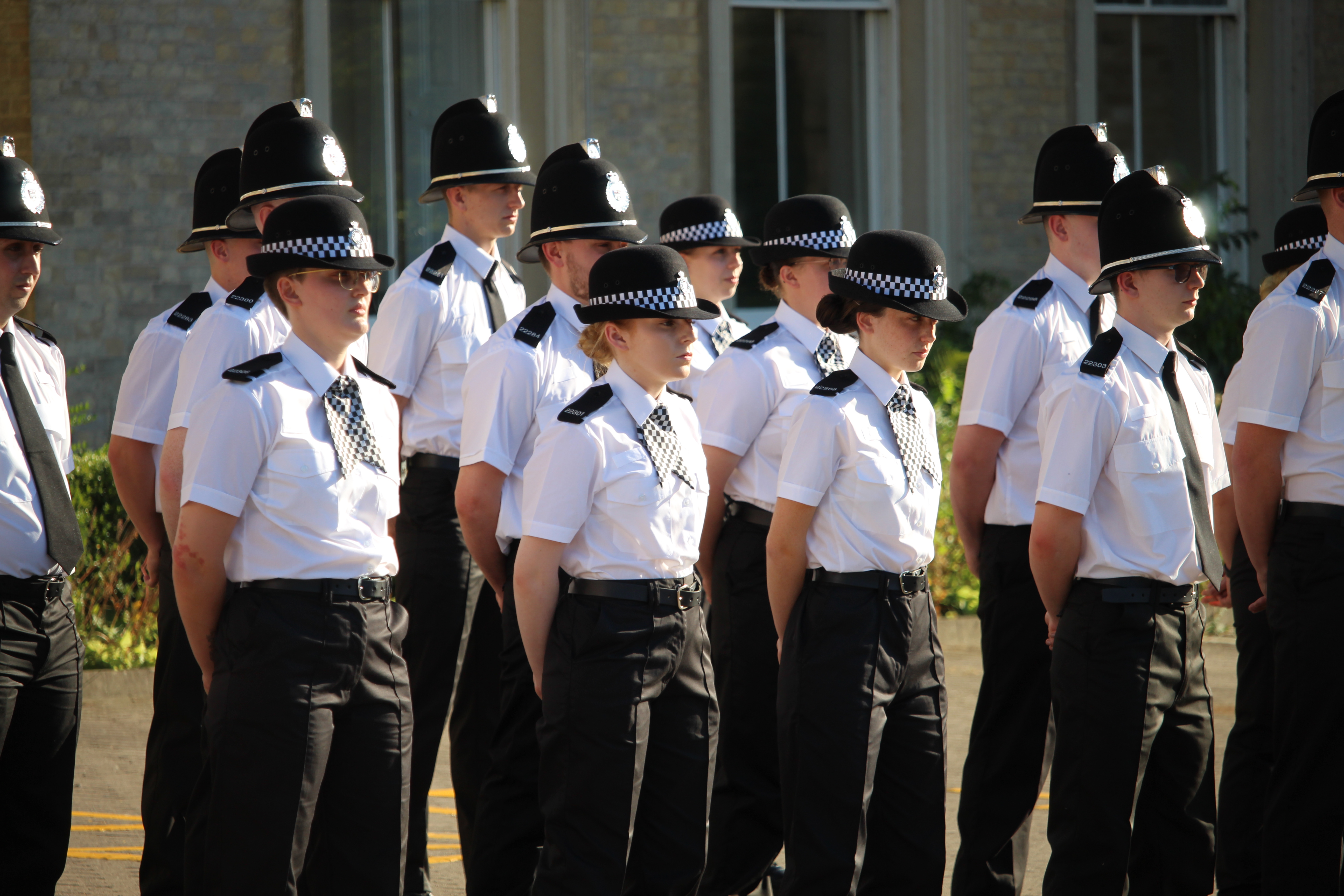 Several new West Mercia Police Officers in uniform at their Passing Out parade