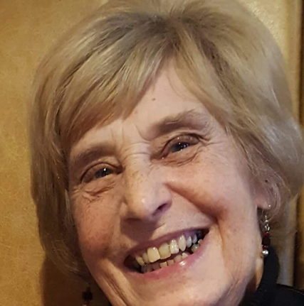 Happy, smiley 78-year-old lady with short blonde hair