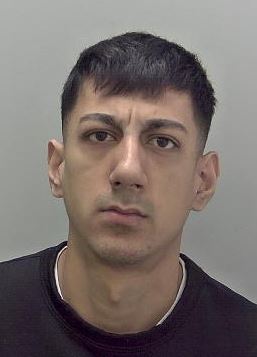 Custody image of man with short dark hair