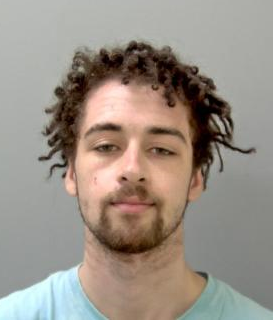 Custody image of man with dark hair