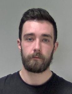 Man with short, dark hair and beard