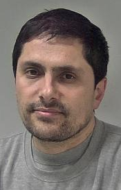 Man with stubble and short dark hair