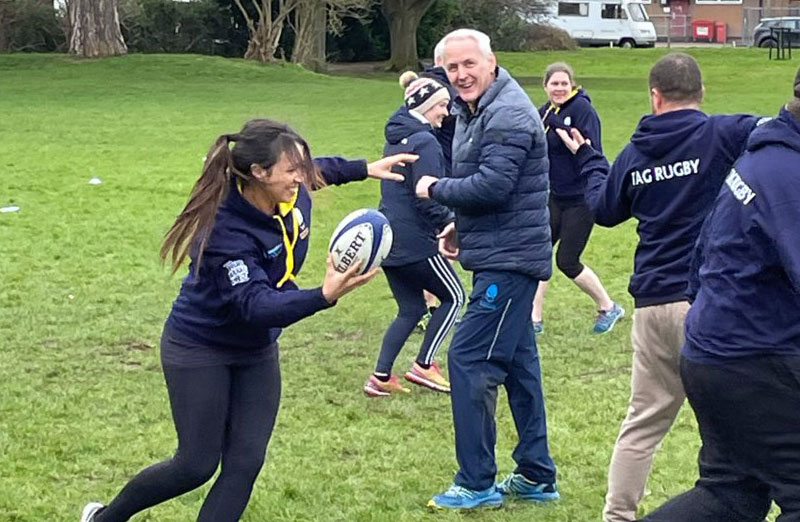 photo of people playing tag rugby