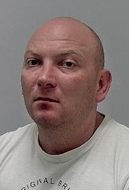 Man with shaven head