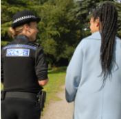 Female police officer and female member of the public out walking