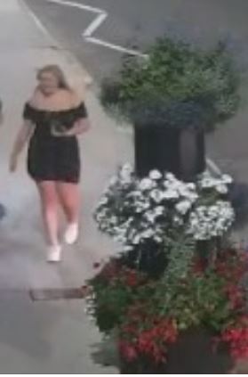Woman in black dress with blonde hair