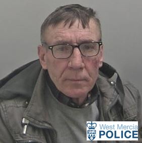 man in 50's with brown hair and glasses 