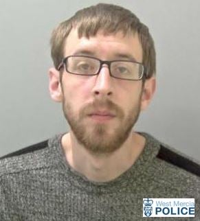 man in 30's with beard and glasses 