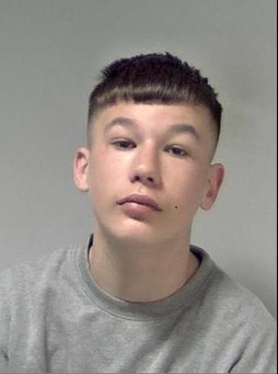 A boy of 15 with short dark hair