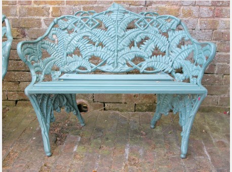 a picture of the stolen bench. Blue with leaf deign up the back. 