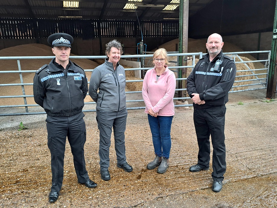Rural crime officers stood with a farmer