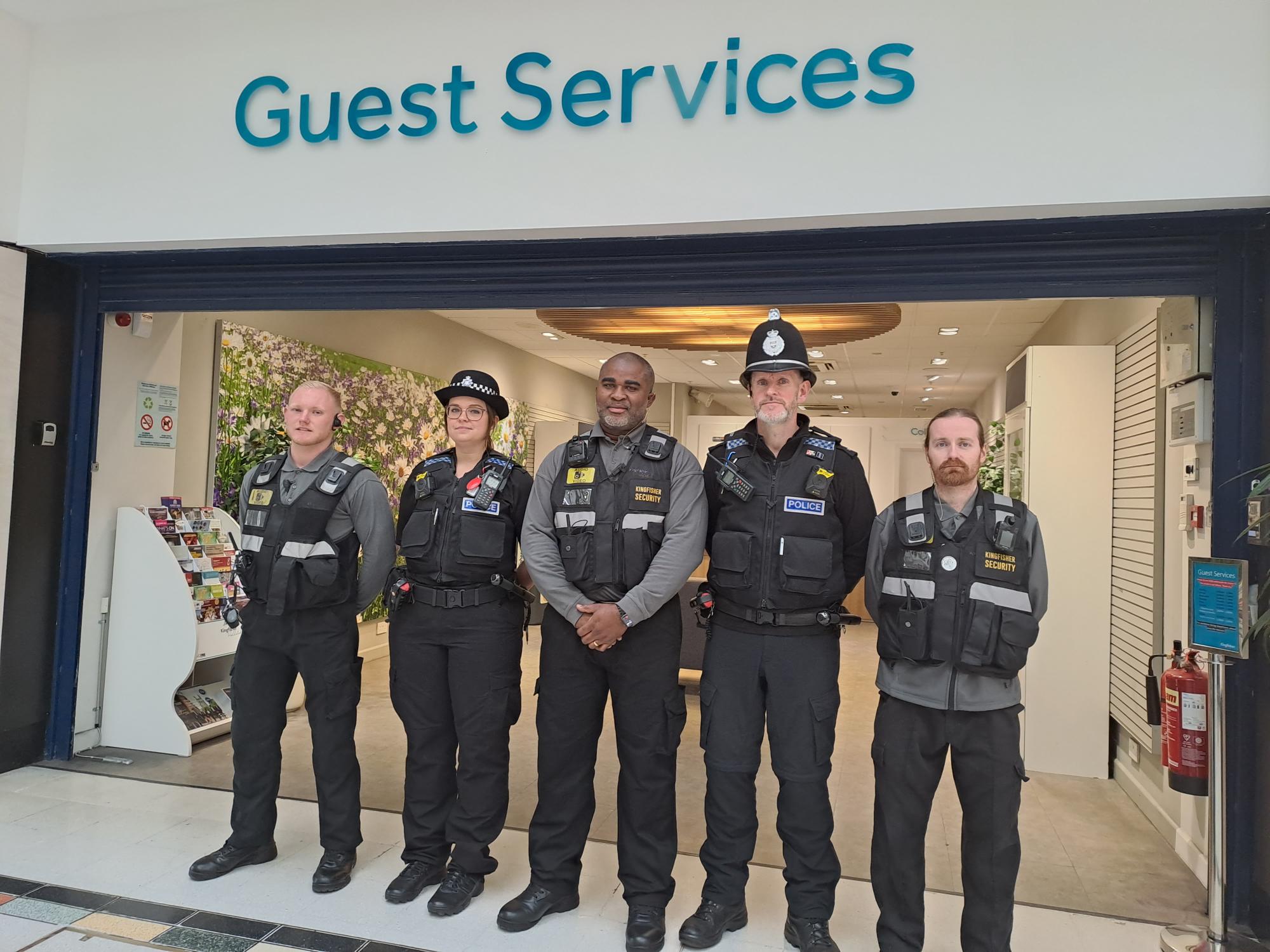 Security staff and Redditch police officers line up at the Kingfisher Shopping Centre