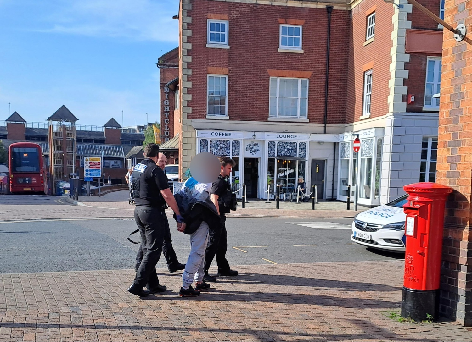 Police officers arrest a suspect