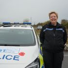 Kim next to one of the trainer police vehicles