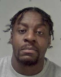 A man with a goatee beard and short dreadlock hair