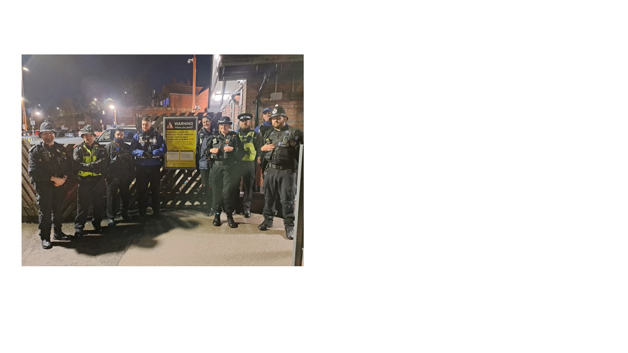 Group picture of partners during joint op outside station 
