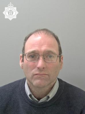 White man with glasses and short hair 