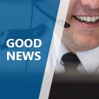Graphic with the wording 'good news' and a close up of a male call handler smiling