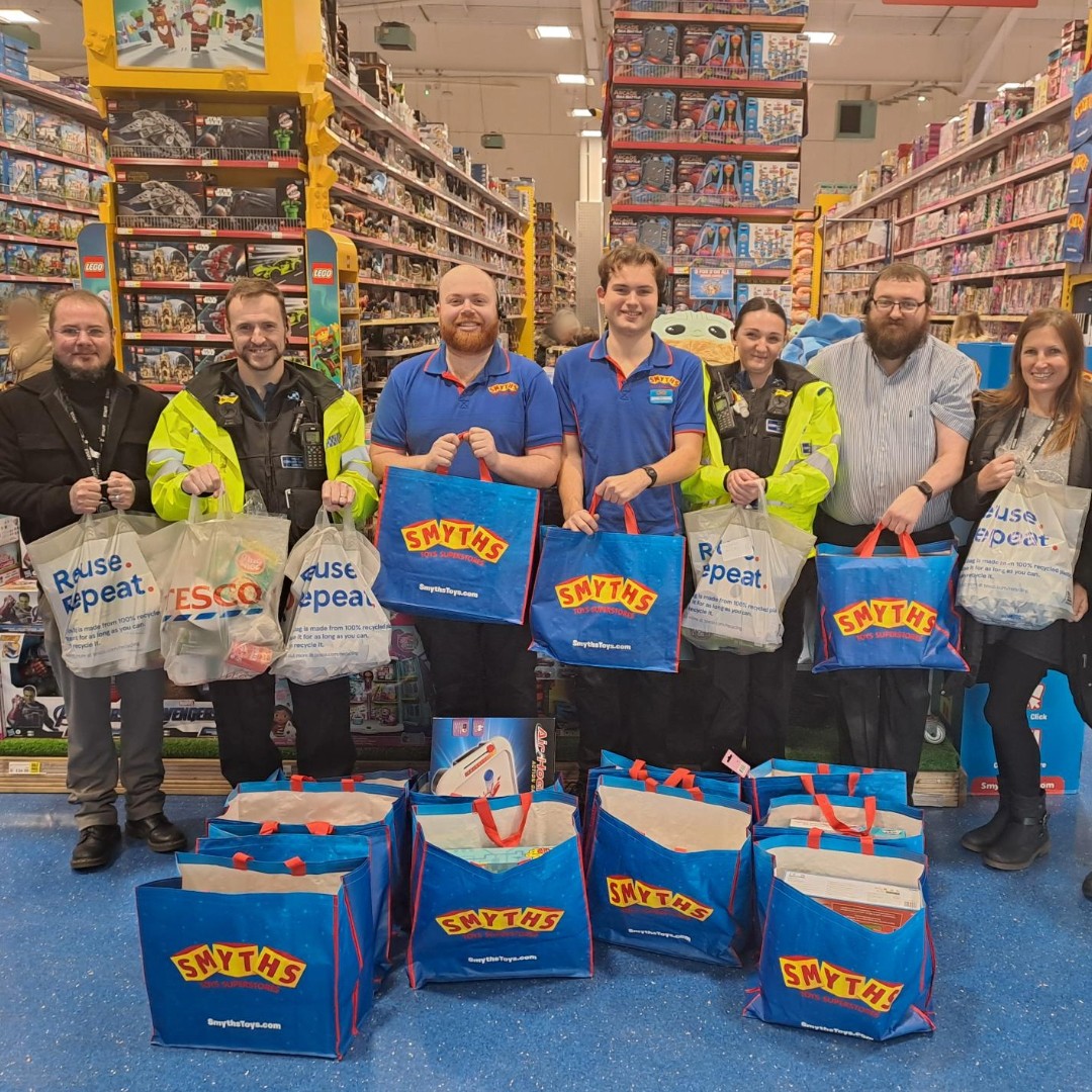 Police, council and shop staff with the festive supplies
