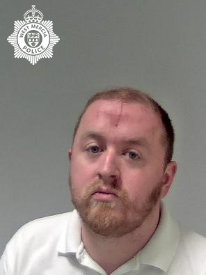 white man with ginger facial hair. 
