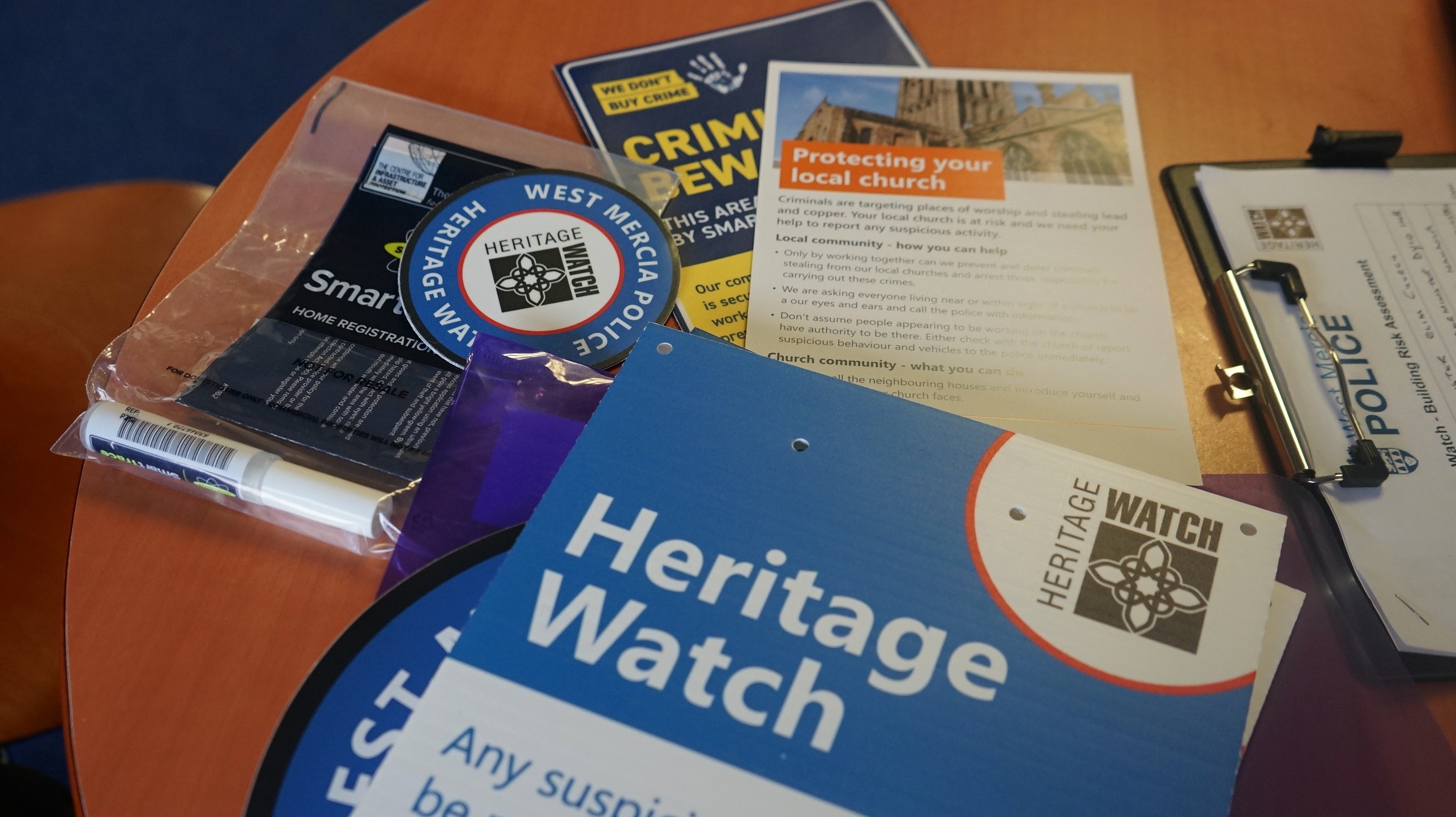 Heritage watch logo and text 