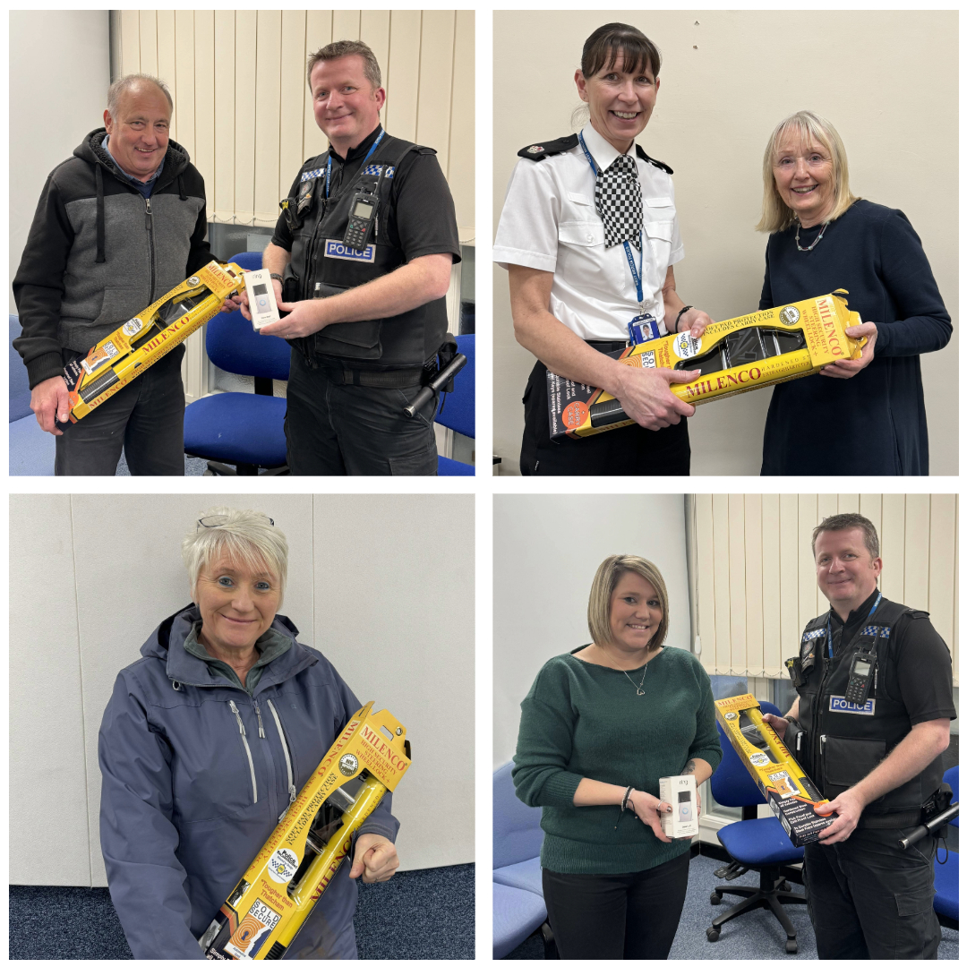 Competition winners collect their prizes from police officers