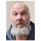 Man with beard and grey hoodie
