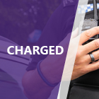 Officer with hand on radio police car in the background with purple overlay 