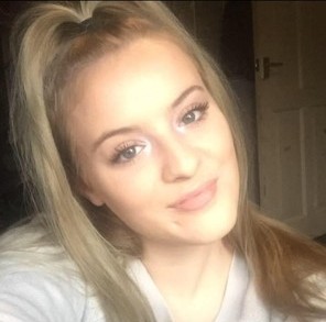 White female, brown eyes, blonde hair.