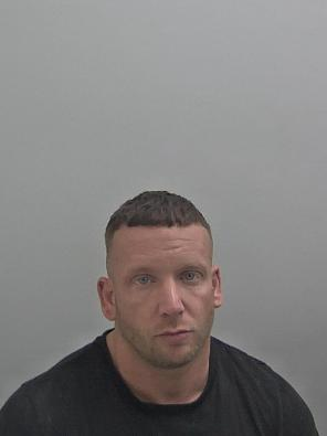 White male, short brown hair.