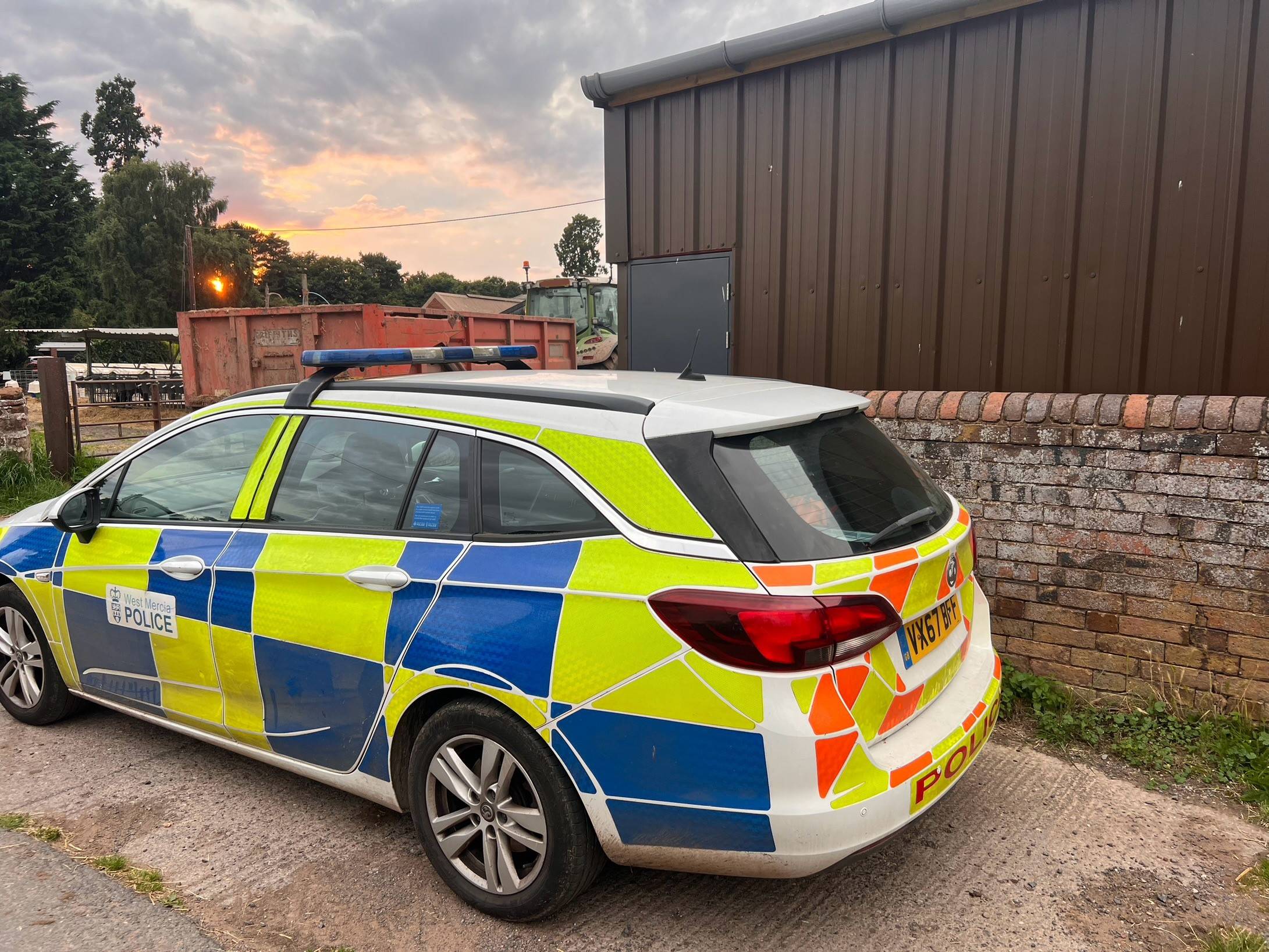 Patrol car parked at farm