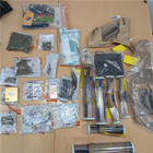 A picture of seized drugs and items from a warrant