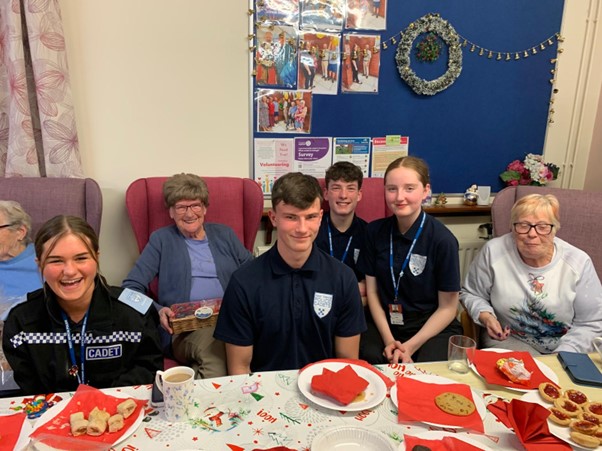 Police cadets, smiling.