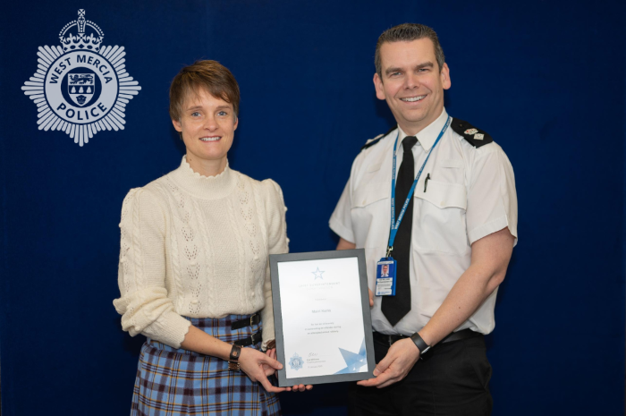 Mairi Kerin being presented with her award by Chief Supt Edd Williams