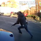 Armed police officer running towards  a suspect during an arrest.