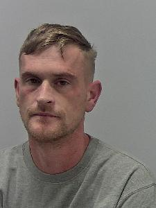 White male with short blonde hair. 