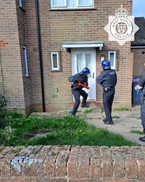 Officers carrying out a warrant in Telford
