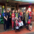 Group picture of officers and people from Acorns.