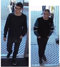 two men wearing dark clothing, both wearing glasses 