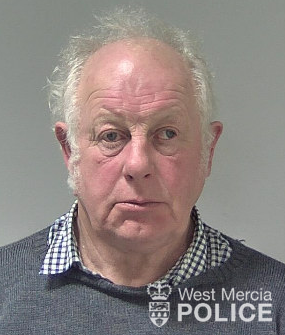 balding man with grey hair 