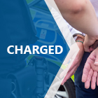 Charged title with person in handcuffs