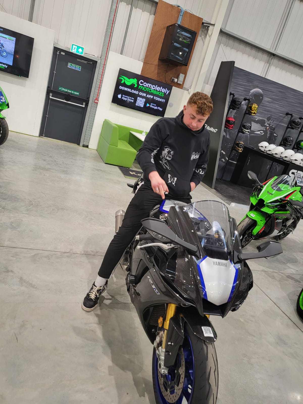 man on bike in a shop