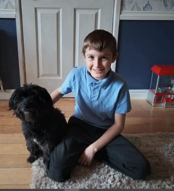 young boy with dog