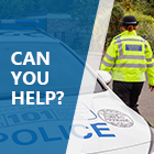 PCSO walking alongside a police car