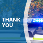 Police car lights, flashing blue. 