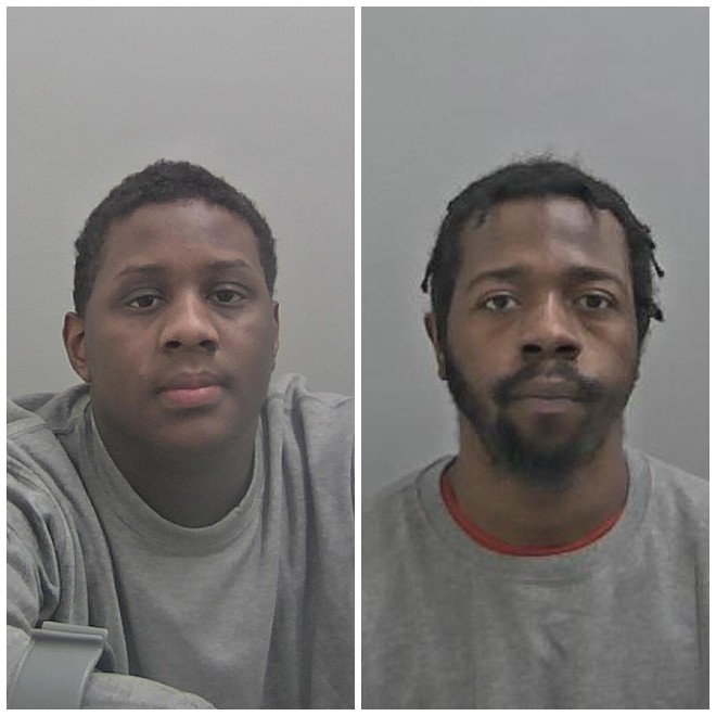 Two black men, dark short hair. Man on left has dark facial hair.