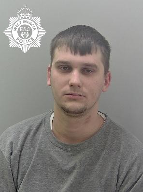 White male, brown short hair, grey jumper.